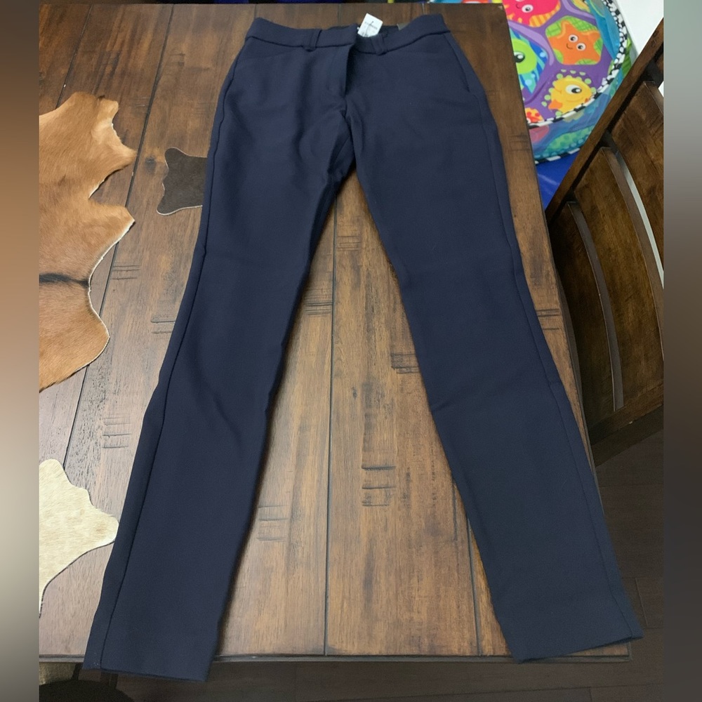 Skinny mid rise pant. Blue in color. Never worn